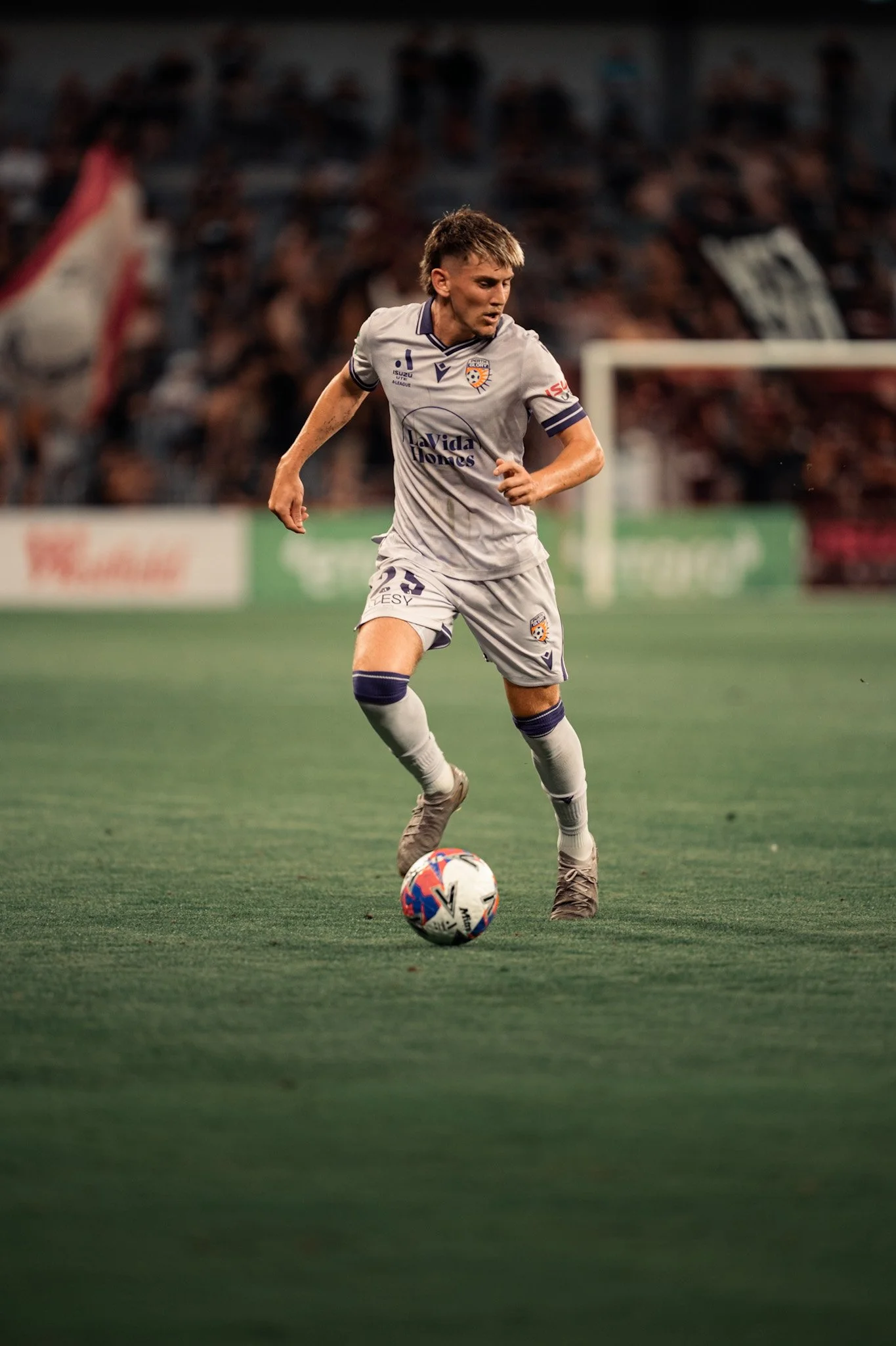 Player in gray dribbling