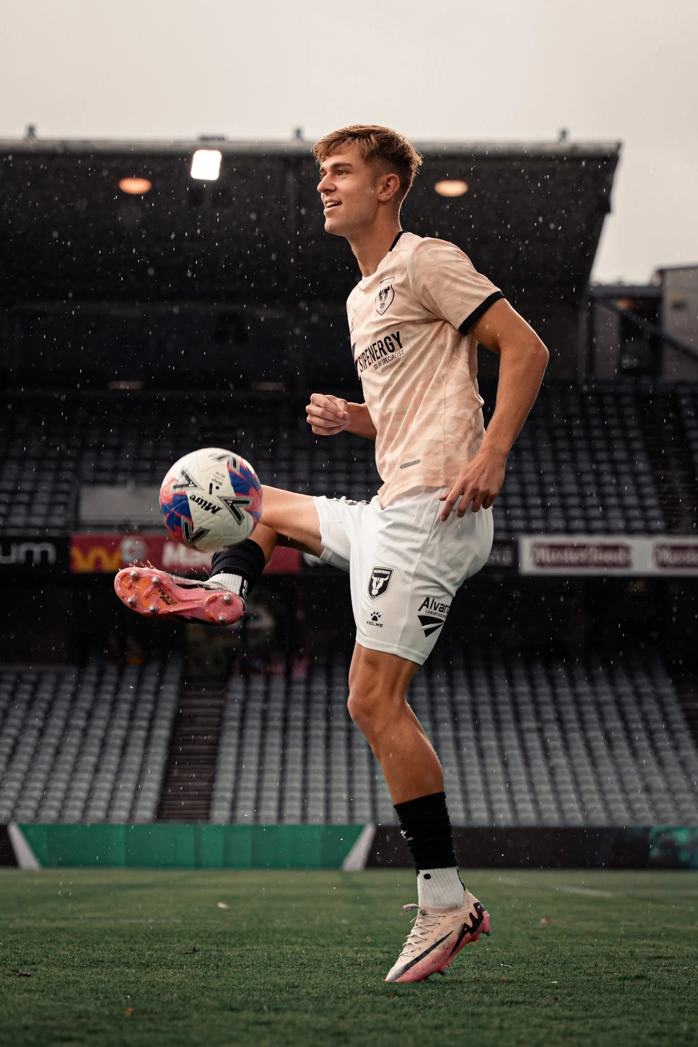Player kicking in the rain
