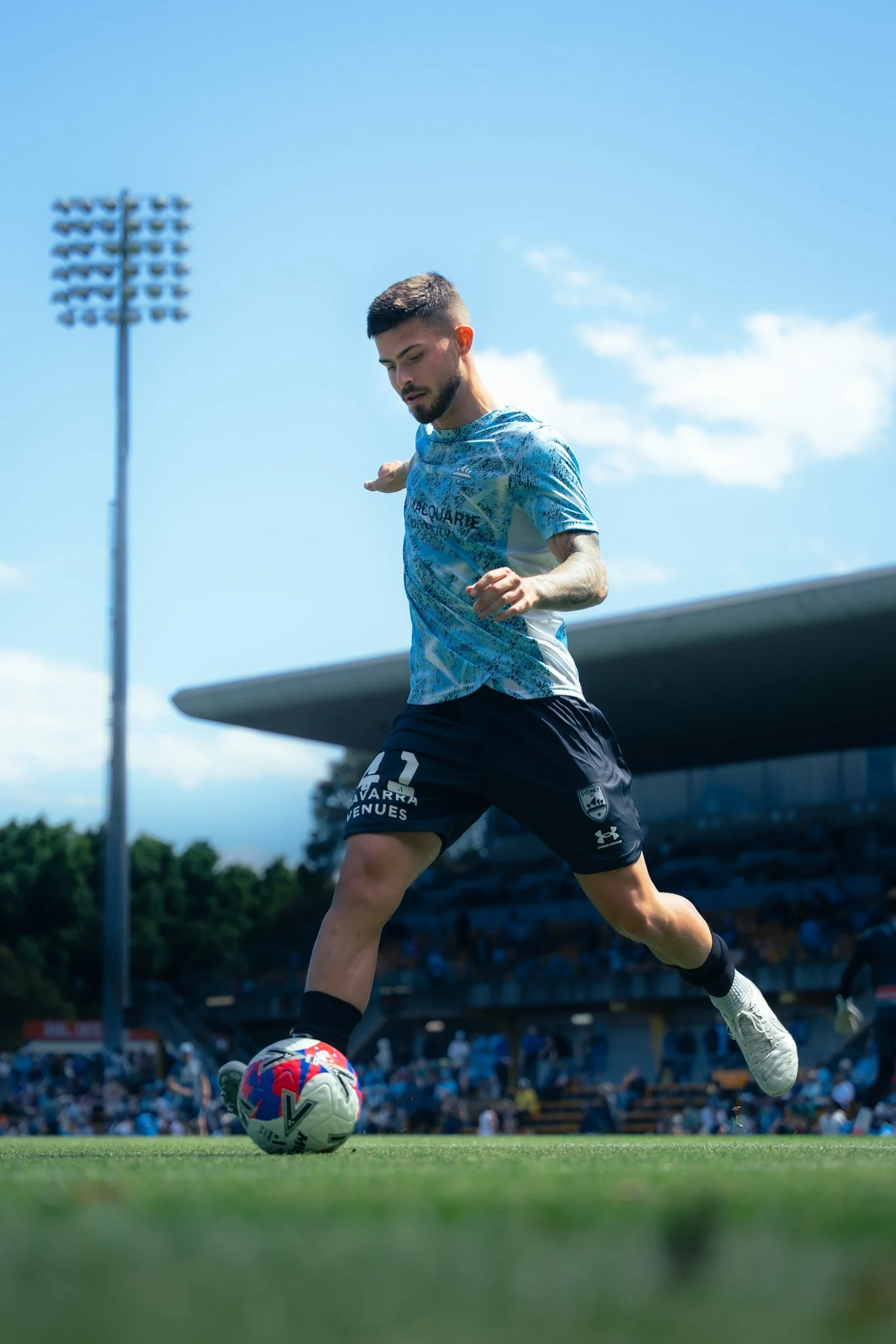 Player in blue and white kicking
