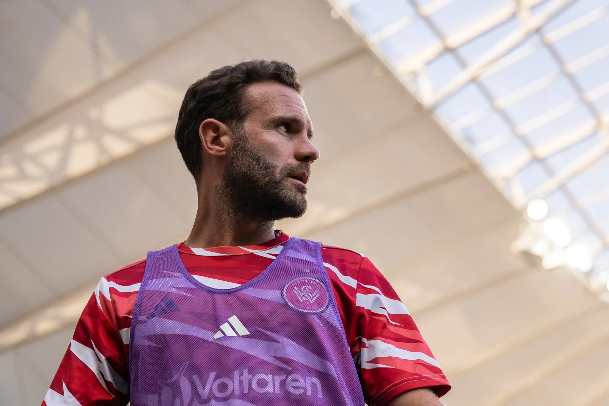 Player in red and white inside stadium
