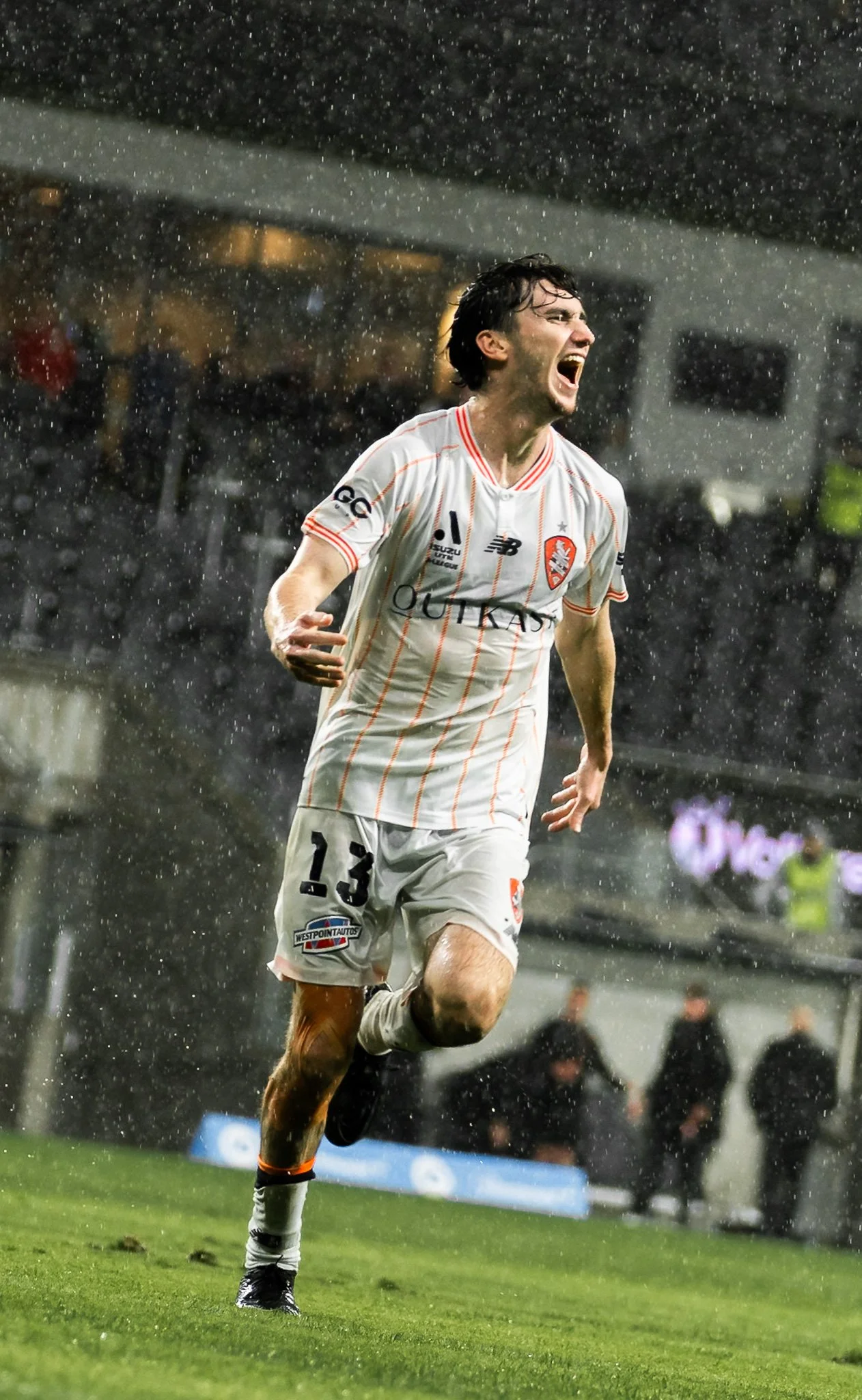 Player celebrating in the rain
