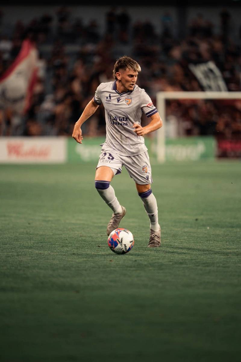 Player in gray dribbling