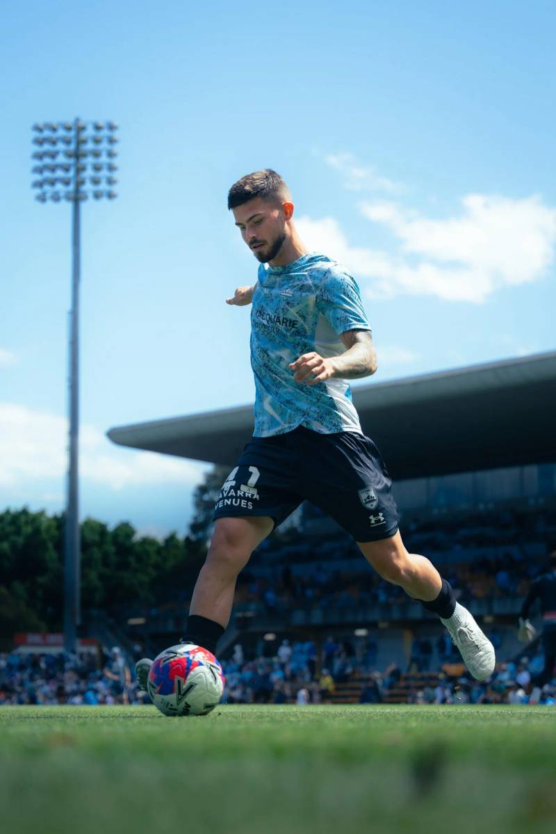 Player in blue and white kicking